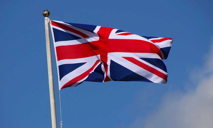 A Person Hoisted The British Flag In Bari Village